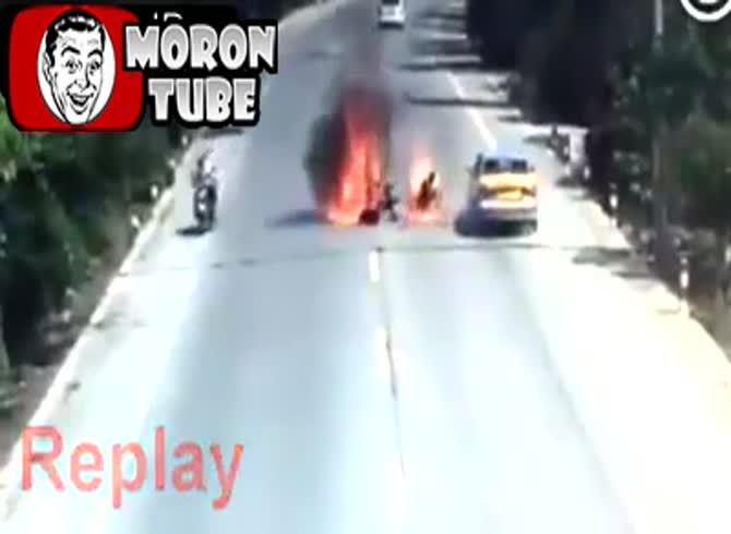Video :His motorcycle catches fire after he collides with a vehicle, and he takes it with him